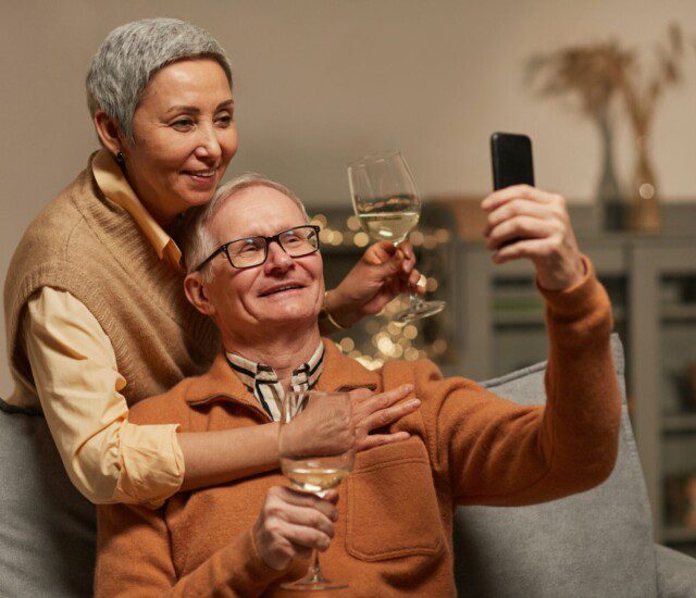couple taking a selfie while enjoying some wine