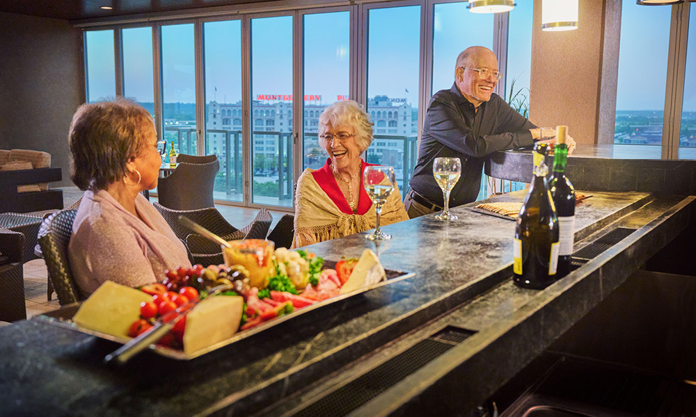 three elderly having a glass of wine. 2